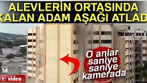 ALEVLERİN ORTASINDA KALAN ADAM AŞAĞI ATLADI